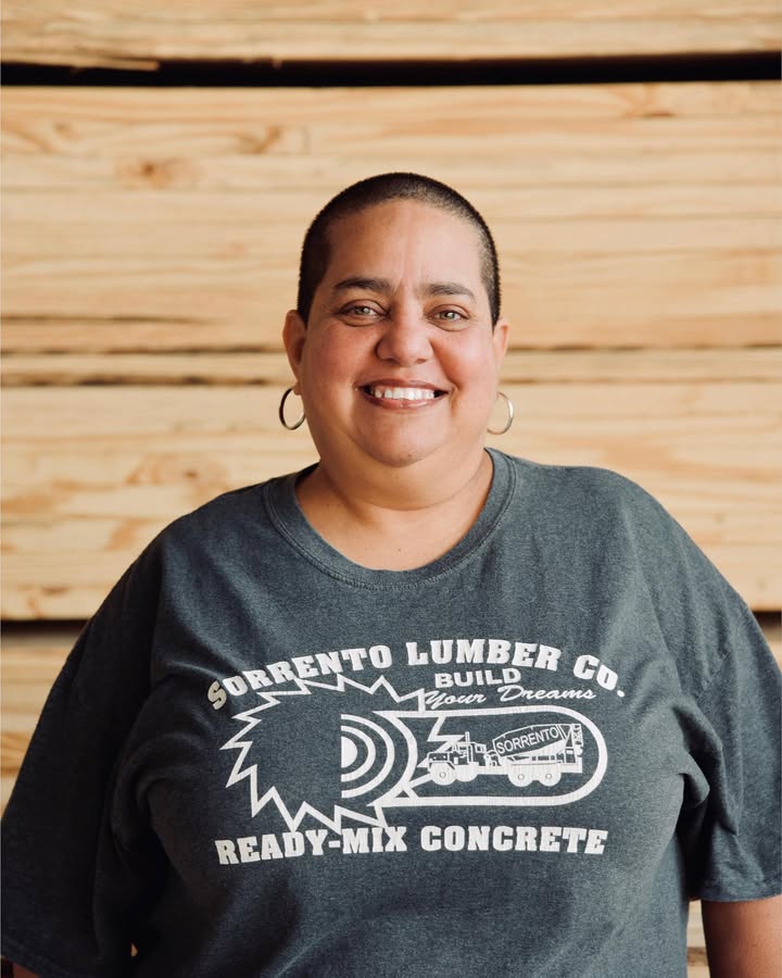 A Sorrento team member in a vintage Sorrento Lumber Co. Build Your Dreams ready-mix shirt