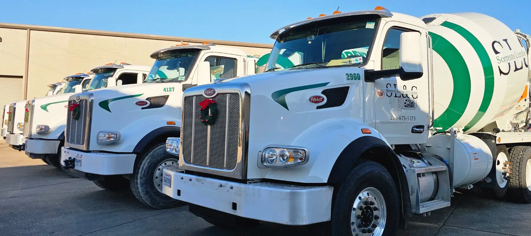 A row of Sorrento ready-mix trucks lined up at the yard