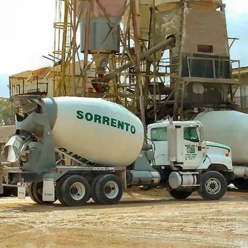 An older Sorrento ready-mix truck at a concrete plant